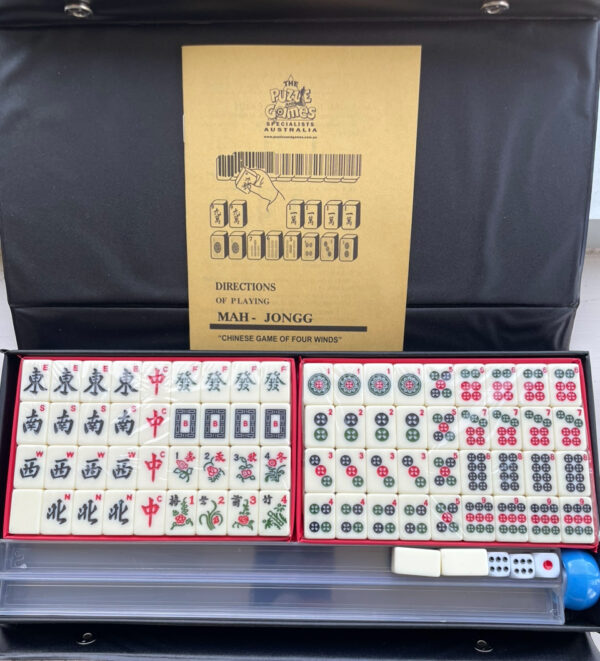 Travel Mahjong in a black vinyl case with Racks